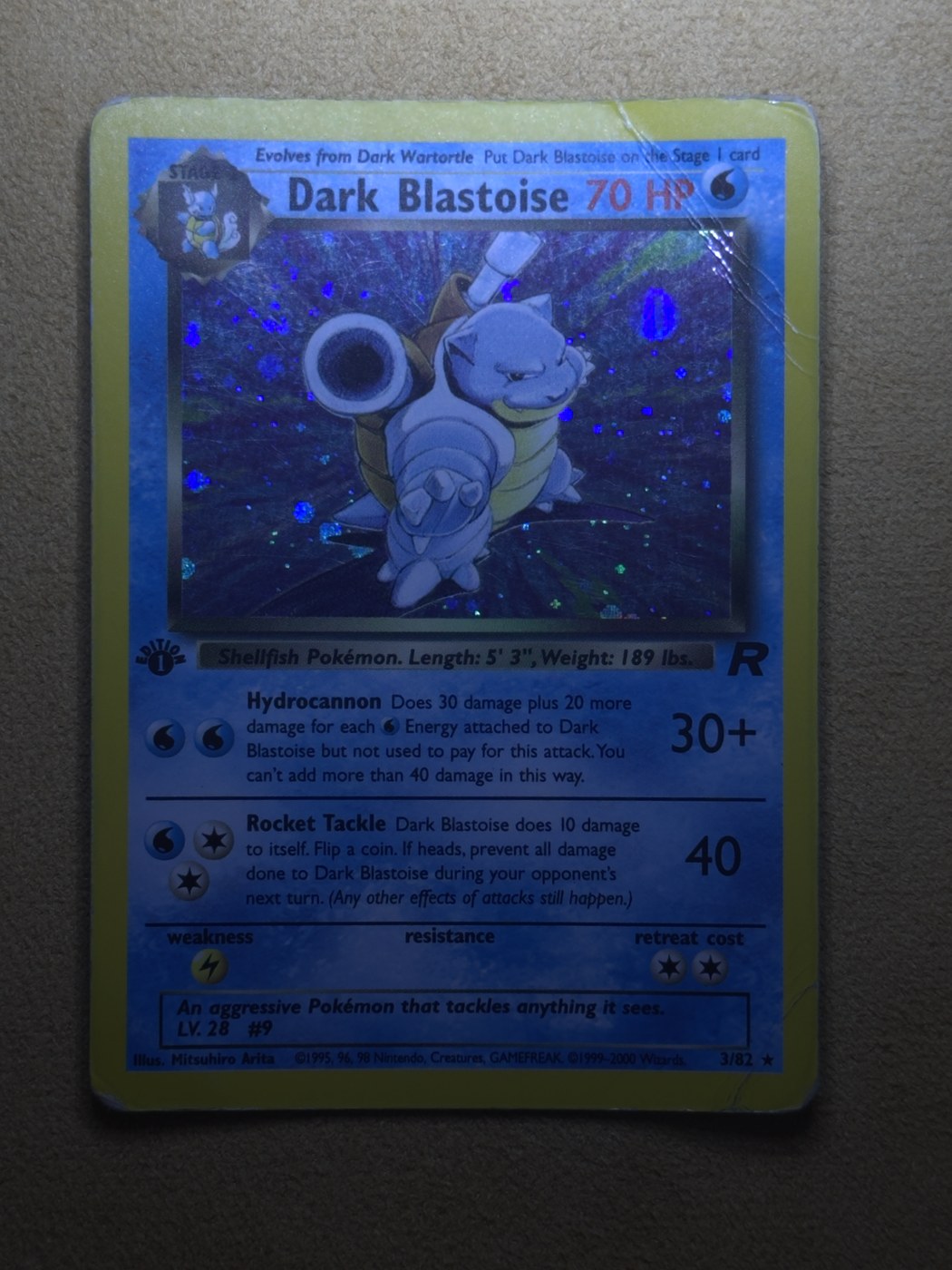 Dark Blastoise 1st Edition card before restoration, with scratches, creases and edge lifting