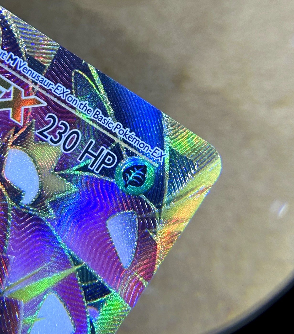 Same card after lifted edge repair by Pokejem
