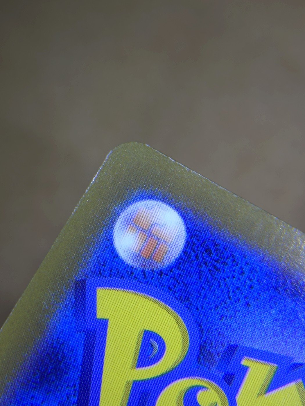 Same card after lifted edge repair by Pokejem